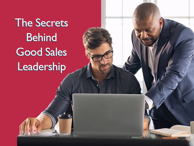 Leader helping sales rep to illustrate good sales leadership
